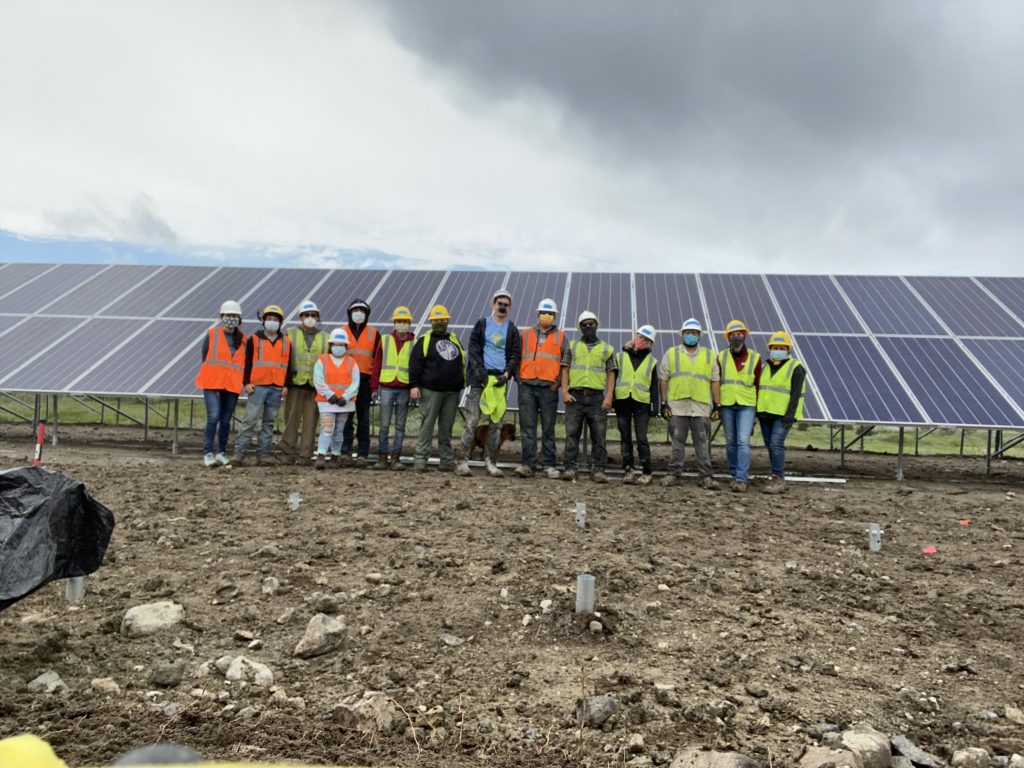 photo of solar panel field in blackfeet nation workers